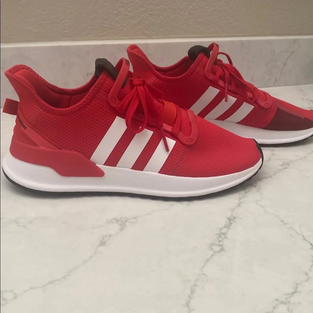 Unisex red adidas shoes